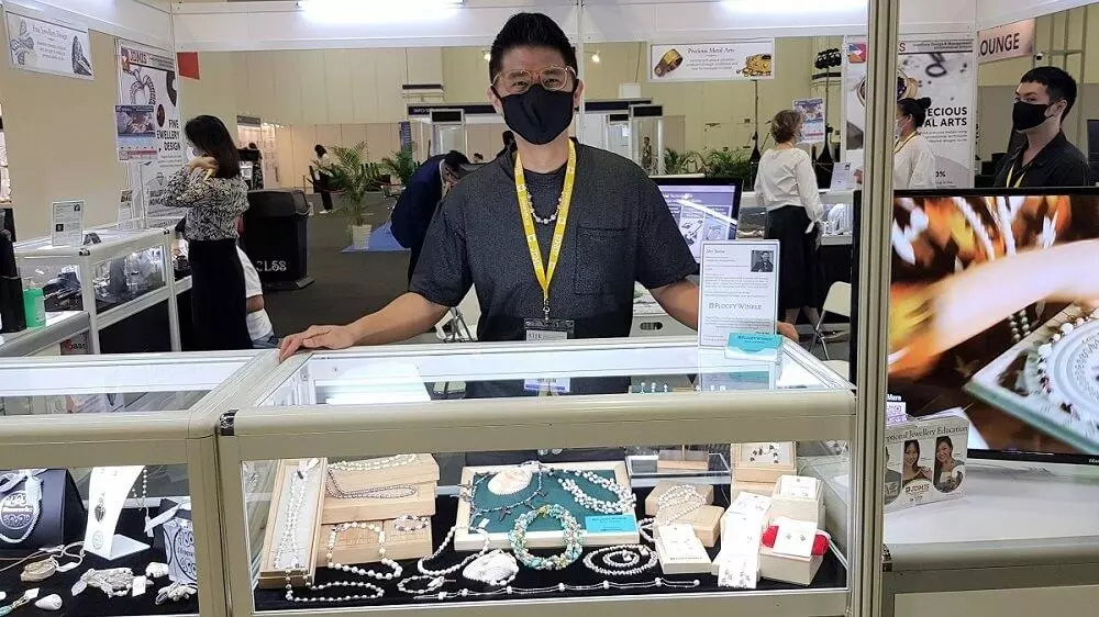 Picture of Sky Seow at his first jewellery exhibition – Singapore International Jewelry Exhibition 2021 